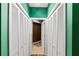 Hallway with double closets leading into bathroom at 220 Renaissance Ne Pkwy # 1115, Atlanta, GA 30308