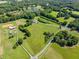 Aerial view showcasing mature trees, ponds, and horse enclosures; a peaceful retreat on expansive land at 226 Euharlee Five Forks Rd, Kingston, GA 30145