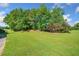 Large flat backyard space with mature trees and landscaping at 226 Euharlee Five Forks Rd, Kingston, GA 30145