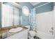 A well-lit bathroom with a sink, toilet, and shower at 226 Euharlee Five Forks Rd, Kingston, GA 30145