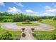 Circular driveway leads to a home surrounded by trees and green lawns at 226 Euharlee Five Forks Rd, Kingston, GA 30145
