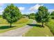 Scenic driveway lined with lush trees leading to a beautiful home at 226 Euharlee Five Forks Rd, Kingston, GA 30145
