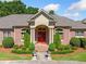 Grand entrance with a brick walkway and beautifully landscaped garden at 226 Euharlee Five Forks Rd, Kingston, GA 30145