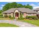 Stately brick home featuring a welcoming front entrance and manicured landscaping, enhancing its curb appeal at 226 Euharlee Five Forks Rd, Kingston, GA 30145