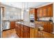 Spacious kitchen featuring an island with granite countertop and bar stool seating, plus wooden cabinetry at 226 Euharlee Five Forks Rd, Kingston, GA 30145
