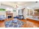 Inviting living room with fireplace, hardwood floors, and comfortable seating, providing a warm and welcoming ambiance at 226 Euharlee Five Forks Rd, Kingston, GA 30145