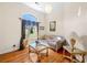 Cozy sitting area with natural light from a large window, hardwood floors, and comfortable seating at 226 Euharlee Five Forks Rd, Kingston, GA 30145