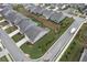 Aerial view of a residential area showcasing well-maintained lawns, neatly arranged homes, and landscaped streets at 242 Aspen Way, Dallas, GA 30157