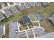 An aerial view showcases the community tennis and bocce ball courts, with convenient parking and attractive landscaping at 242 Aspen Way, Dallas, GA 30157