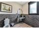 Stylish bathroom featuring modern fixtures and a chic design with dark grey tile at 242 Aspen Way, Dallas, GA 30157