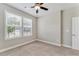 Bright bedroom with carpet, ceiling fan, and natural light from large windows, ready for personalization at 242 Aspen Way, Dallas, GA 30157