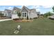 Well-maintained single Gathering home on a green lawn featuring an attached two-car garage, in a Gathering-friendly neighborhood at 242 Aspen Way, Dallas, GA 30157