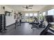 Well-equipped gym with fitness equipment and plenty of natural light at 242 Aspen Way, Dallas, GA 30157