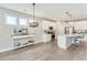 Bright, open kitchen with white cabinets, stainless steel appliances, and a large island with seating at 242 Aspen Way, Dallas, GA 30157