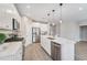 Modern kitchen with stainless steel appliances, quartz countertop and wood flooring at 242 Aspen Way, Dallas, GA 30157