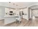 Modern kitchen with island, stainless steel appliances, and stylish pendant lighting at 242 Aspen Way, Dallas, GA 30157