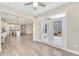 Open concept living area featuring hardwood floors, access to backyard, and modern kitchen at 242 Aspen Way, Dallas, GA 30157