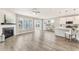 Open-concept living space with a fireplace, kitchen, and hardwood floors for modern living at 242 Aspen Way, Dallas, GA 30157