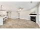 Spacious living room with hardwood floors, fireplace, and plenty of natural light at 242 Aspen Way, Dallas, GA 30157