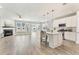 Open-concept living area featuring fireplace and abundant natural light at 242 Aspen Way, Dallas, GA 30157