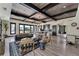 Open-concept lounge area with modern decor, kitchen, and community space at 242 Aspen Way, Dallas, GA 30157