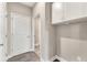 Functional mudroom with white cabinets and convenient access to hallway at 242 Aspen Way, Dallas, GA 30157