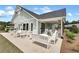 Outdoor patio area with covered seating, overlooking lush green space at 242 Aspen Way, Dallas, GA 30157