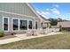 Outdoor patio with ample seating, umbrellas, and community green space at 242 Aspen Way, Dallas, GA 30157