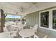 Inviting covered patio with ample seating and ceiling fans, perfect for outdoor gatherings at 242 Aspen Way, Dallas, GA 30157