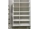 Installed shelving unit in neutral tones for storage options at 242 Aspen Way, Dallas, GA 30157