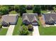 Aerial view of a brick home with a two-car garage, surrounded by well-manicured lawns and mature trees at 314 Santa Anita Ave, Woodstock, GA 30189
