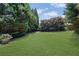 Large, flat backyard offers plenty of space for gardening, recreation, and outdoor entertaining at 314 Santa Anita Ave, Woodstock, GA 30189