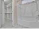 Bathroom features a large soaking tub and a walk-in closet with ample storage at 314 Santa Anita Ave, Woodstock, GA 30189