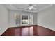 Spacious bedroom with hardwood floors, a ceiling fan, and natural light at 314 Santa Anita Ave, Woodstock, GA 30189