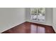 Bedroom features hardwood floors, a large window, and ample natural light at 314 Santa Anita Ave, Woodstock, GA 30189