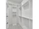 Walk-in closet boasts an organized layout with shelves and ample hanging space at 314 Santa Anita Ave, Woodstock, GA 30189