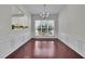 Elegant dining room with hardwood floors, wainscoting, and a chandelier at 314 Santa Anita Ave, Woodstock, GA 30189