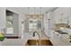 Bright kitchen with white cabinets, modern appliances, and a center island at 314 Santa Anita Ave, Woodstock, GA 30189