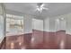 Inviting living room with hardwood floors, connecting seamlessly to the kitchen and dining areas at 314 Santa Anita Ave, Woodstock, GA 30189