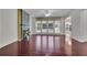 Bright living room with hardwood floors, fireplace, large windows, and neutral paint at 314 Santa Anita Ave, Woodstock, GA 30189