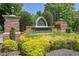 Brookshire neighborhood entrance with brick pillars, decorative sign, and manicured landscaping at 314 Santa Anita Ave, Woodstock, GA 30189