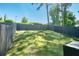 The backyard is fenced in with a lush green lawn at 4406 Richmond Court Ct, Stone Mountain, GA 30083