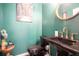 Chic bathroom with dark fixtures, adding a modern touch and an artistic piece, offering a unique and stylish space at 4406 Richmond Court Ct, Stone Mountain, GA 30083