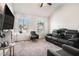 Comfortable living room featuring a plush reclining sofa, an accent chair, and a large screen television at 4406 Richmond Court Ct, Stone Mountain, GA 30083