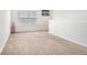 A spacious and well-lit loft area with plush carpet, perfect for a playroom or extra living space at 4406 Richmond Court Ct, Stone Mountain, GA 30083