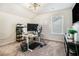 Bright home office with modern desk setup, monitor, and ample natural light at 4406 Richmond Court Ct, Stone Mountain, GA 30083
