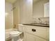 Bathroom featuring a vanity sink, mirror, and tiled bath and shower combo at 924 Park Gate Pl, Stone Mountain, GA 30083