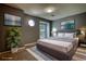 Bedroom features a gray accent wall, neutral carpet and an octagonal window for plenty of natural light at 924 Park Gate Pl, Stone Mountain, GA 30083