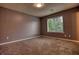Neutral bedroom with a large window offering natural light and scenic views at 924 Park Gate Pl, Stone Mountain, GA 30083