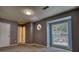 Bedroom features a gray accent wall, neutral carpet and an octagonal window for plenty of natural light at 924 Park Gate Pl, Stone Mountain, GA 30083